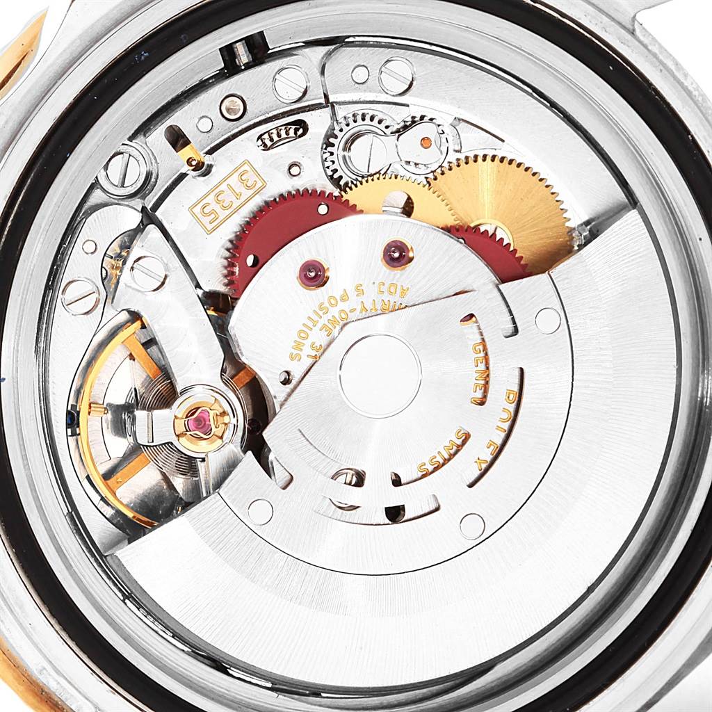 This image shows a close-up view of the movement and internal mechanics of the Rolex Submariner 16613 Men's Steel and Gold (two tone) Black Dial 16613 Men's Steel and Gold (two tone) Black Dial watch.