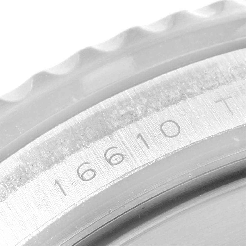 The image shows a close-up of the bezel and case of the Rolex Submariner 16610LV Men
s Stainless Steel Black Dial 16610LV Men
s Stainless Steel Black Dial, focusing on the model number engraving.