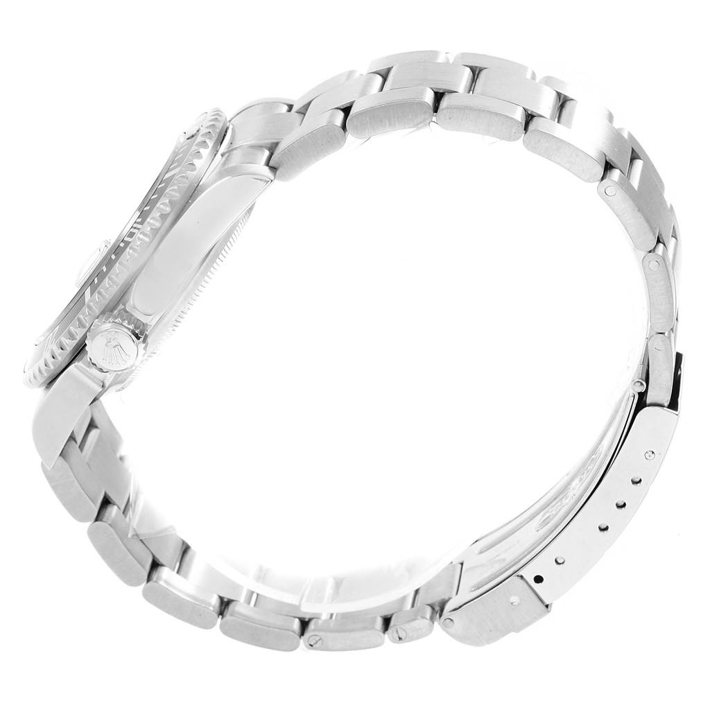 The image shows a side profile view of the Rolex Submariner 16610 Men
s Stainless Steel Black Dial 16610 Men
s Stainless Steel Black Dial watch, highlighting its case, crown, and metal bracelet with clasp.