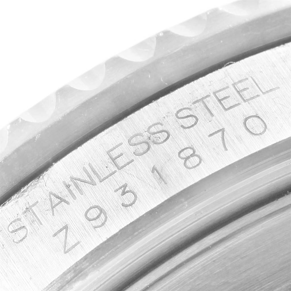 This image shows a close-up of the case side engravings on a Rolex Submariner 16610 Men
s Stainless Steel Black Dial 16610 Men
s Stainless Steel Black Dial watch, highlighting the stainless steel material and serial number.