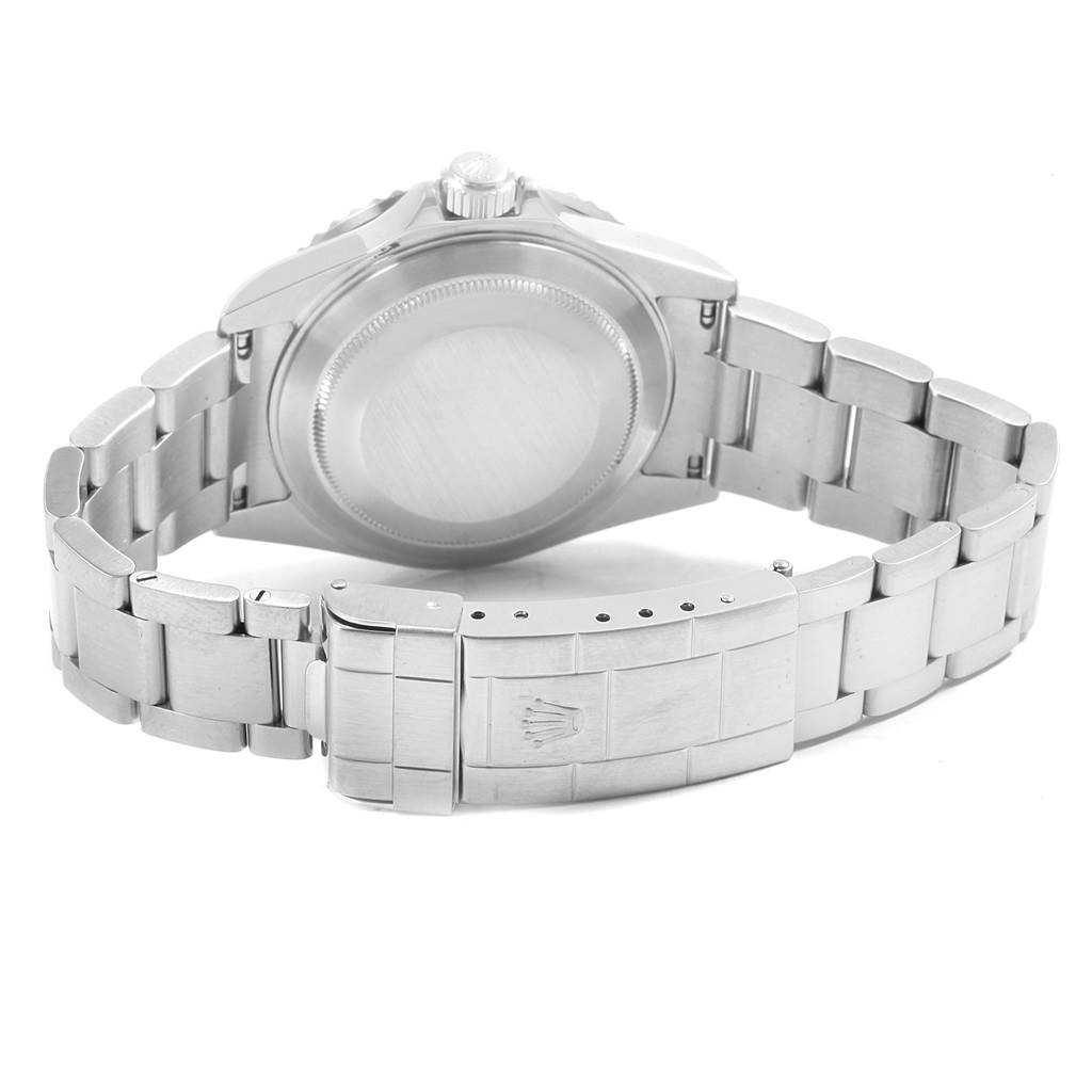 The image shows the back case and metal bracelet of a Rolex Submariner 16610 Men
s Stainless Steel Black Dial 16610 Men
s Stainless Steel Black Dial watch from a rear angle.