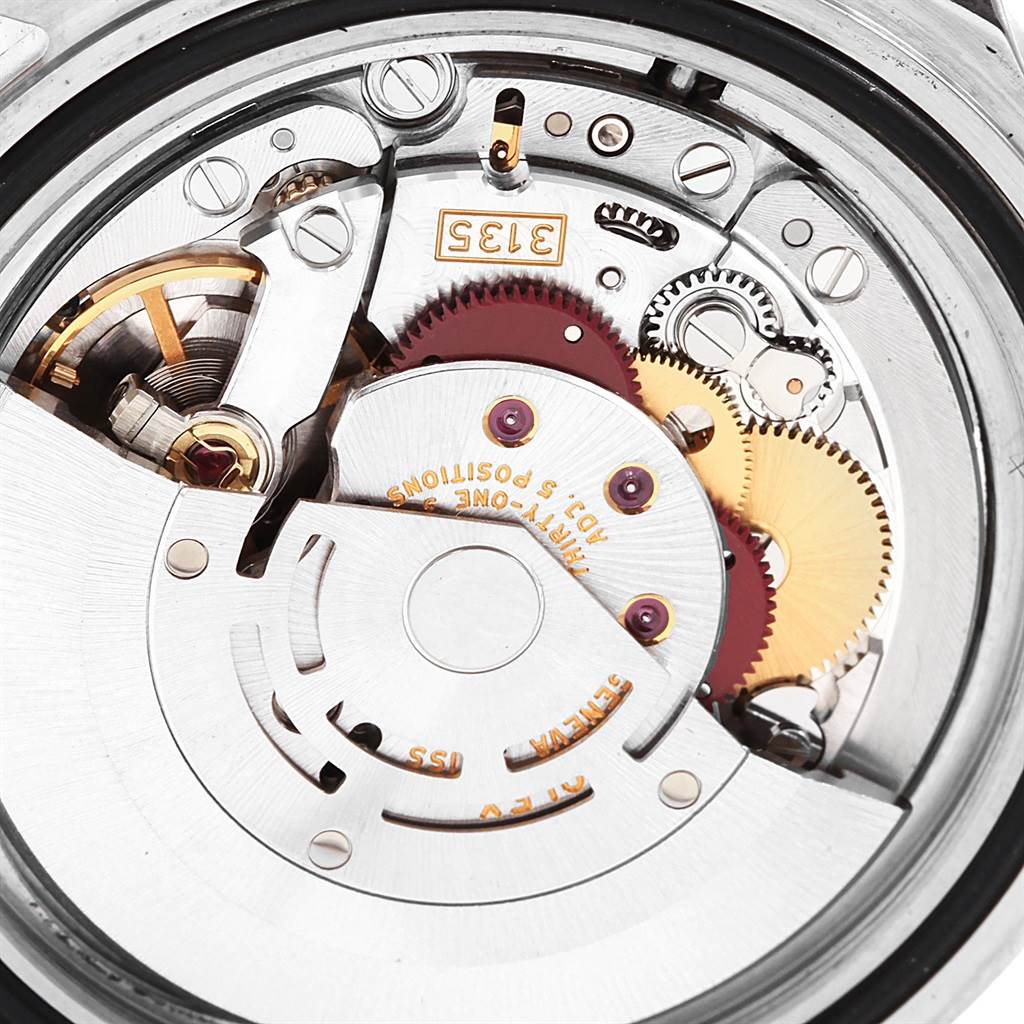 This image shows the internal movement mechanism of a Rolex Submariner 16610 Men
s Stainless Steel Black Dial 16610 Men
s Stainless Steel Black Dial watch, highlighting its gears and components.