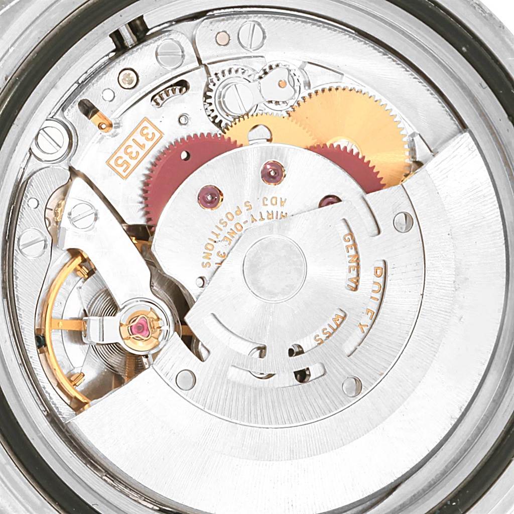 This image shows the internal mechanism and movement of a Rolex Submariner 16610LV Men
s Stainless Steel Black Dial 16610LV Men
s Stainless Steel Black Dial watch, viewed from the back.
