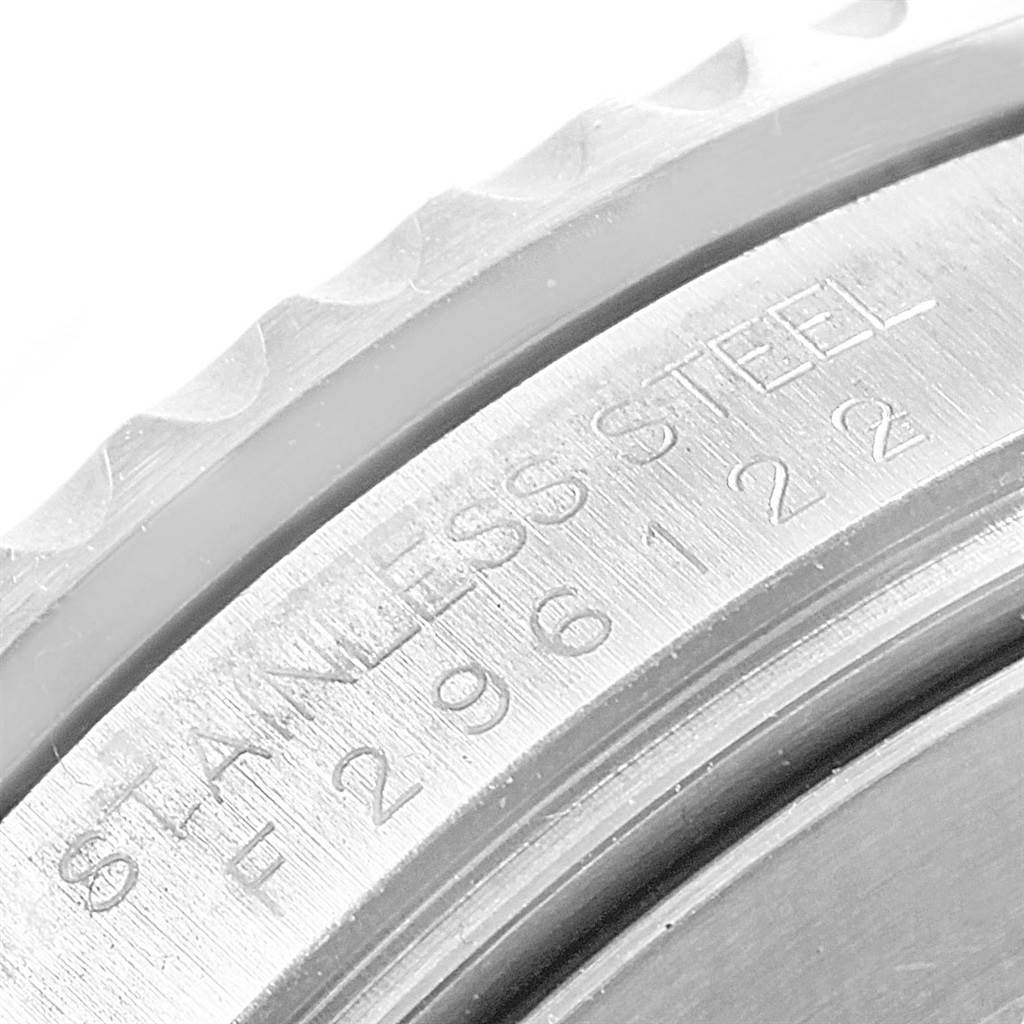 The image shows a close-up of the side bezel and serial number engraving on a stainless steel Rolex Submariner 16610LV Men
s Stainless Steel Black Dial 16610LV Men
s Stainless Steel Black Dial watch.