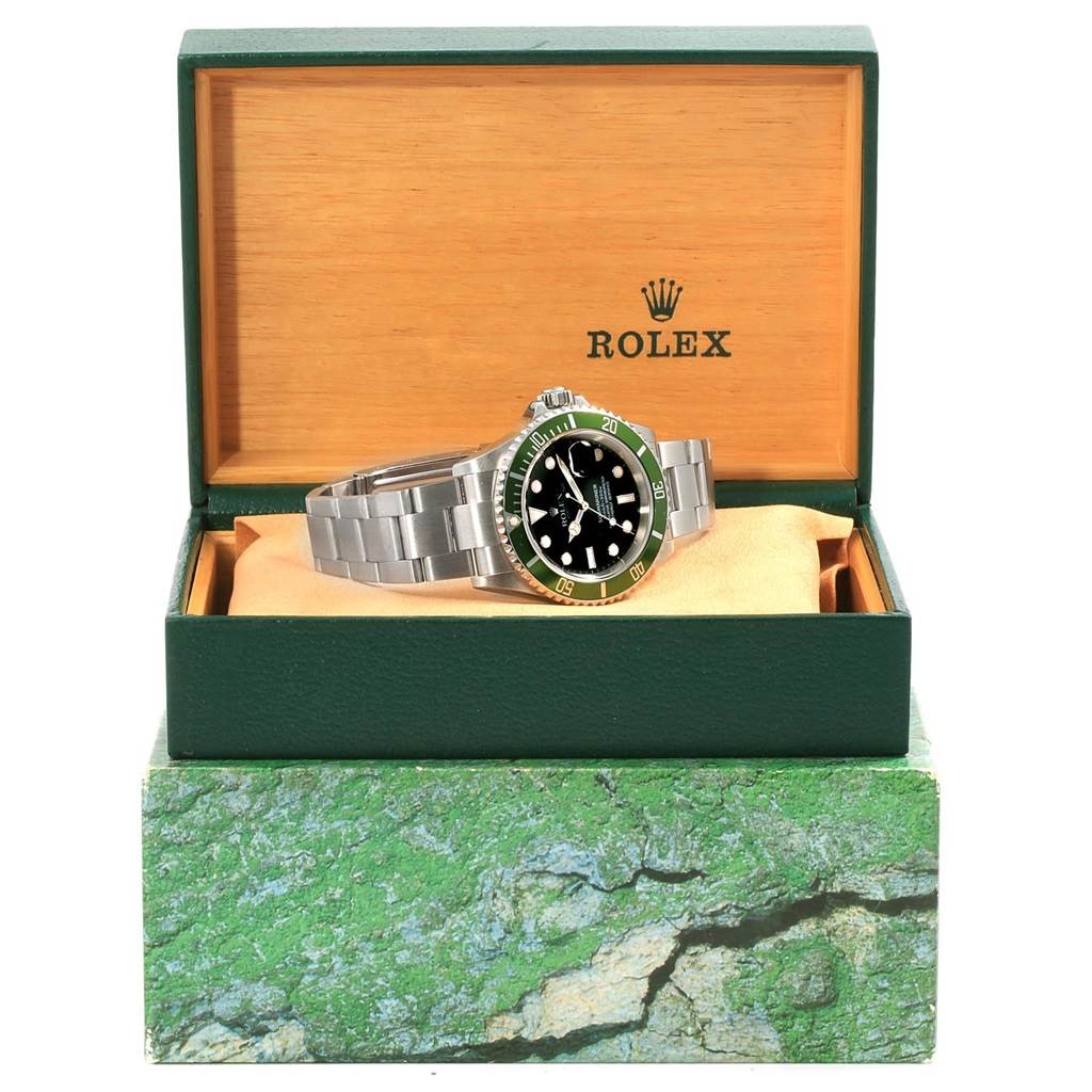 The Rolex Submariner 16610LV Men
s Stainless Steel Black Dial 16610LV Men
s Stainless Steel Black Dial watch is shown with the front face and bracelet visible, placed inside its open box.