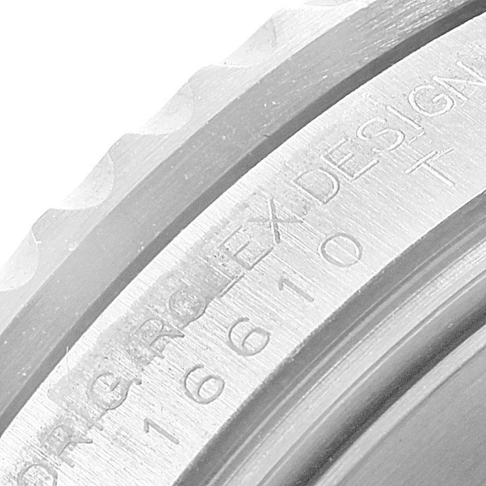 The image shows a close-up angle of the bezel and inner ring containing the model and serial number of a Rolex Submariner 16610LV Men
s Stainless Steel Black Dial 16610LV Men
s Stainless Steel Black Dial watch.