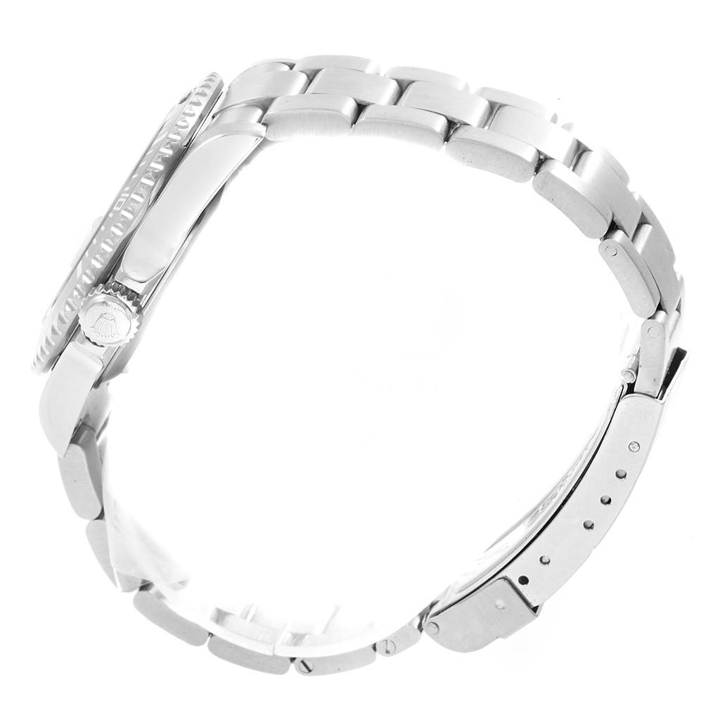 This side view of the Rolex Submariner 16610LV Men
s Stainless Steel Black Dial 16610LV Men
s Stainless Steel Black Dial watch showcases the crown, bezel, and metal bracelet.