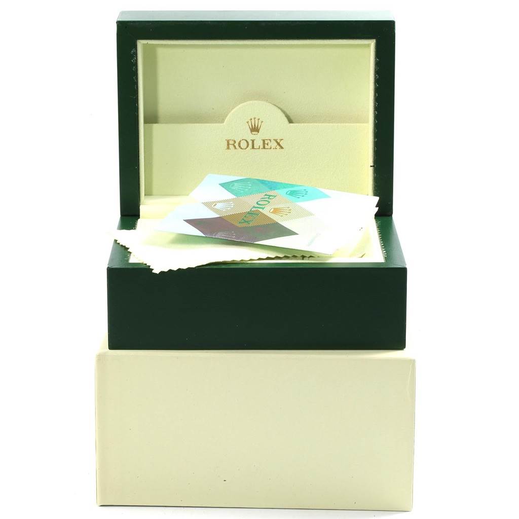 This image shows the open box and protective pouch for the Rolex Submariner 16613 Men
s Steel and Gold (two tone) Grey Dial 16613 Men
s Steel and Gold (two tone) Grey Dial, including documentation.