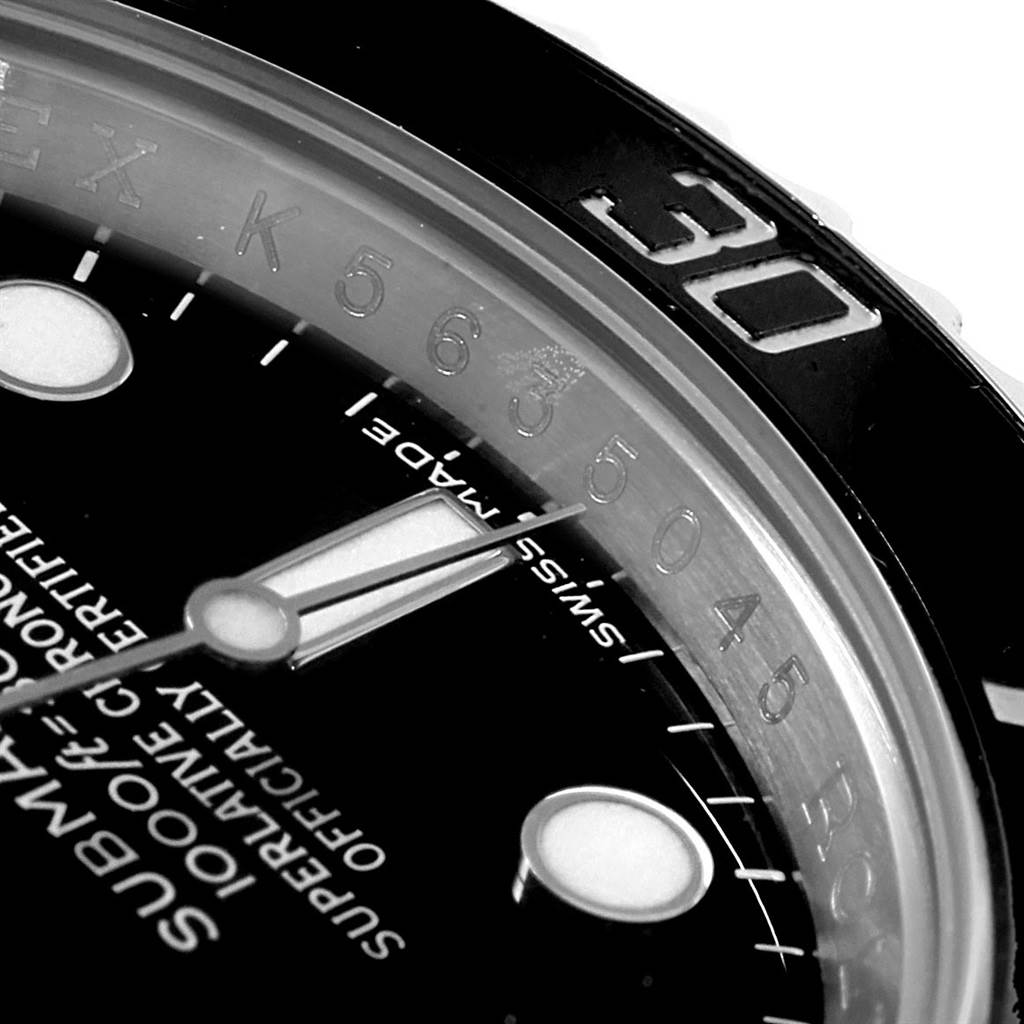 This close-up shot of the Rolex Submariner 116610 Men
s Stainless Steel Black Dial 116610 Men
s Stainless Steel Black Dial shows part of the dial, hour marker, and the bezel with the "30" minute mark.
