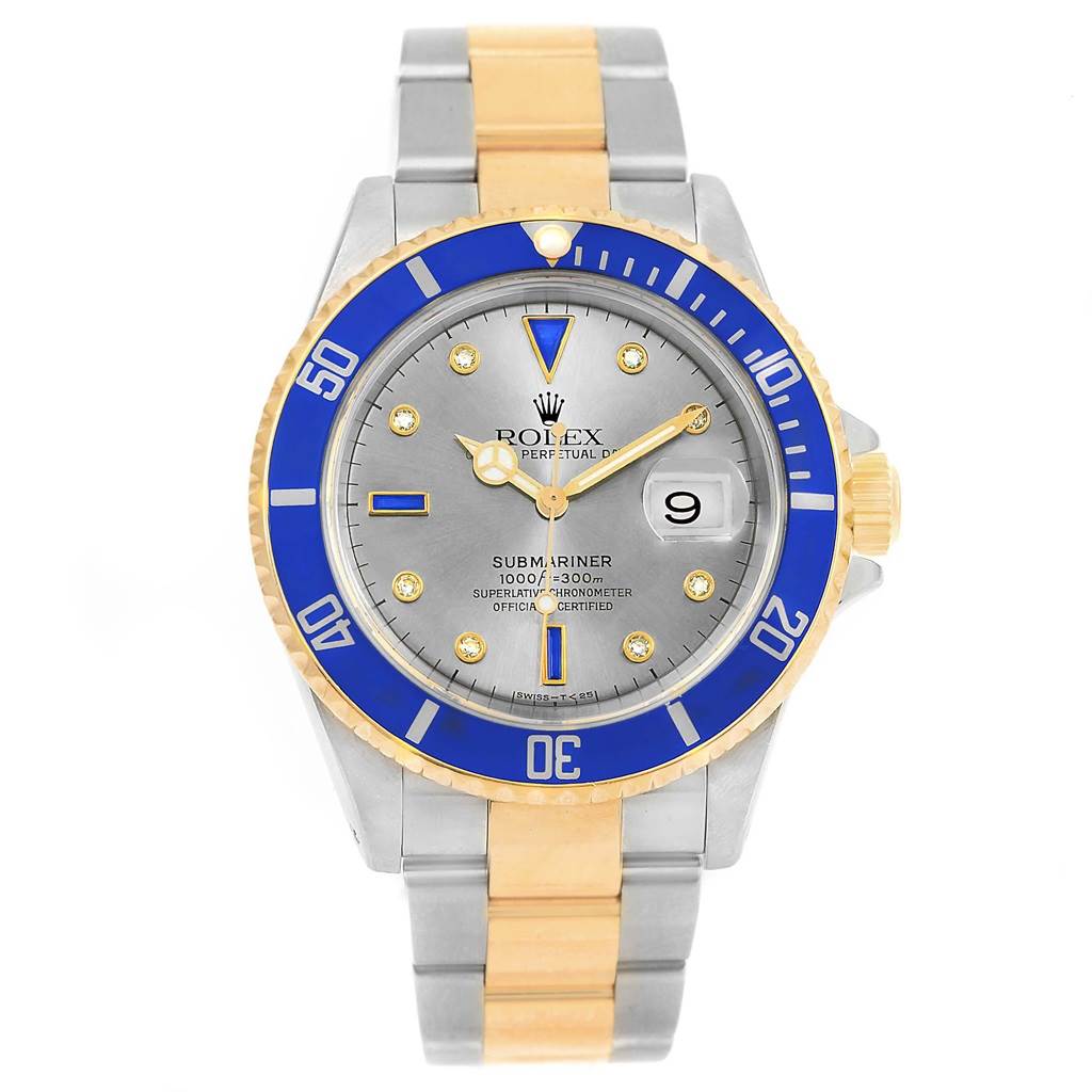 This Rolex Submariner 16613 Men
s Steel and Gold (two tone) Grey Dial 16613 Men
s Steel and Gold (two tone) Grey Dial watch is shown from a front angle, highlighting its blue bezel, gray dial, and two-tone bracelet.