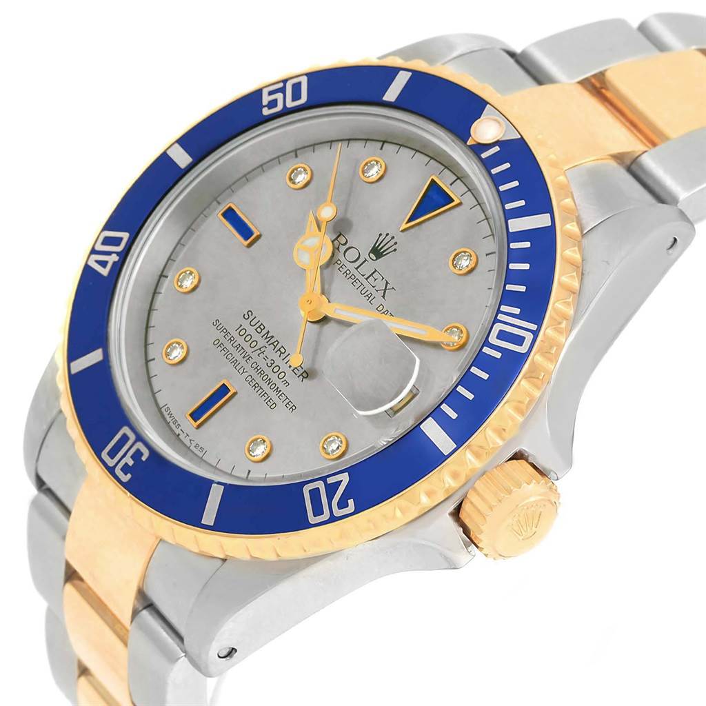 This image shows a close-up of the Rolex Submariner 16613 Men
s Steel and Gold (two tone) Grey Dial 16613 Men
s Steel and Gold (two tone) Grey Dial, highlighting its face, bezel, crown, and part of the bracelet.