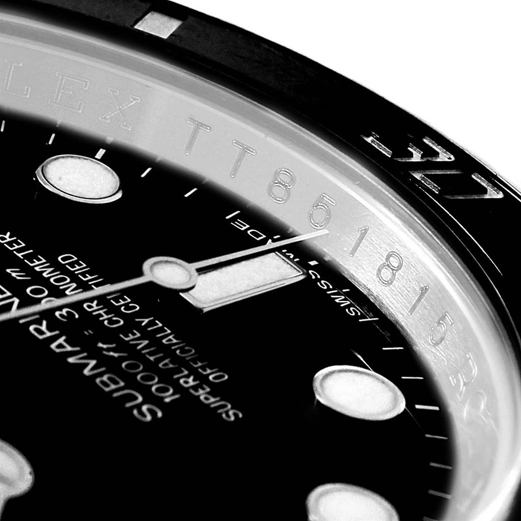 The image shows a close-up of the dial, hour markers, hands, and inner bezel inscription of a Rolex Submariner 114060 Men
s Stainless Steel Black Dial 114060 Men
s Stainless Steel Black Dial watch.