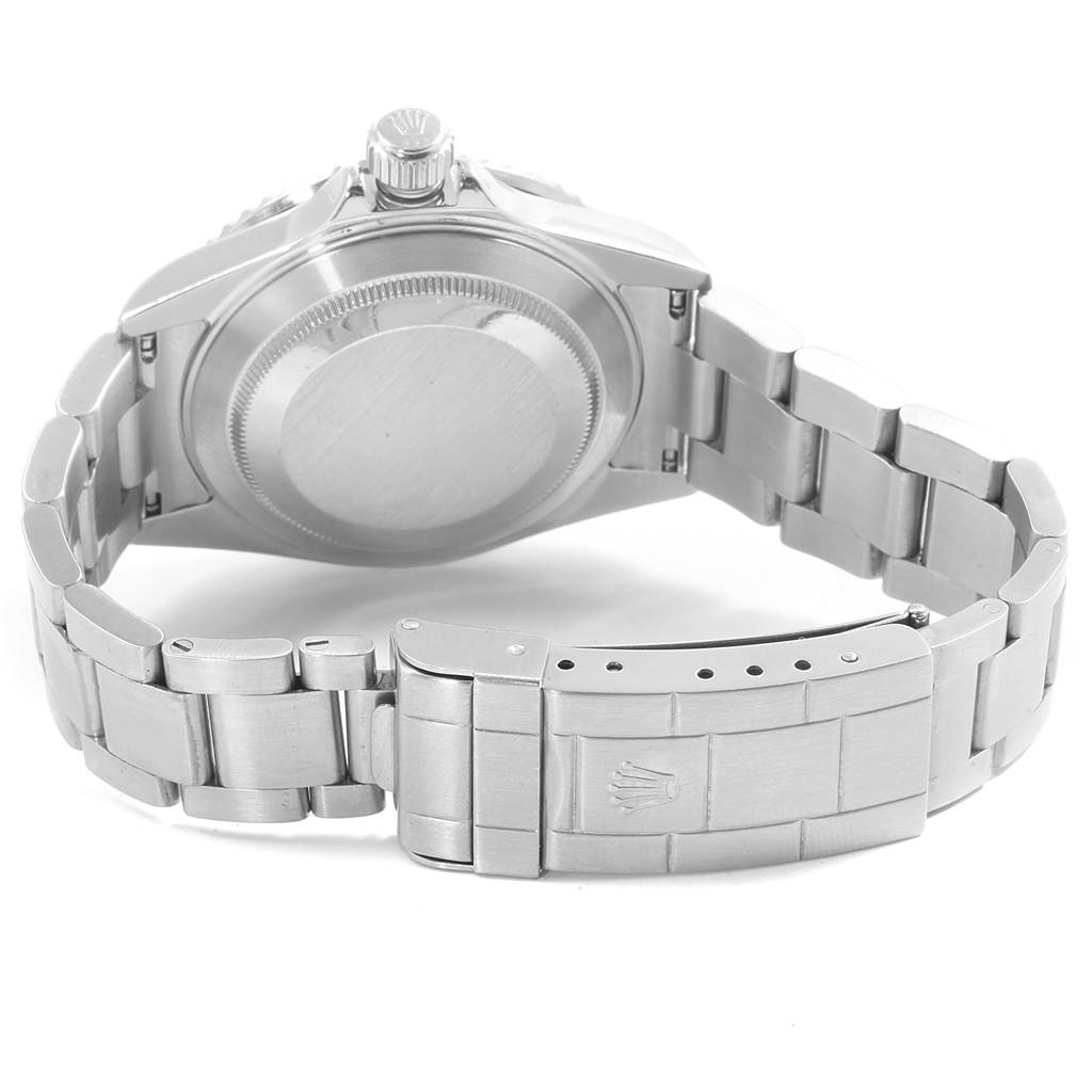 The image shows the back and clasp of a Rolex Submariner 16610 Men
s Stainless Steel Black Dial 16610 Men
s Stainless Steel Black Dial model watch, specifically the case back and the bracelet.