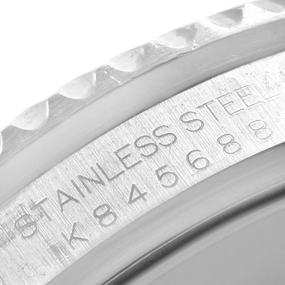 This is a close-up shot showing the engraved markings on the bezel and the inner rim of a Rolex Submariner 16610 Men
s Stainless Steel Black Dial 16610 Men
s Stainless Steel Black Dial watch.