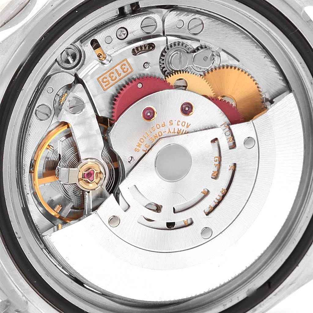 The image shows a close-up of the internal movement mechanism of a Rolex Submariner 16610 Men
s Stainless Steel Black Dial 16610 Men
s Stainless Steel Black Dial watch.