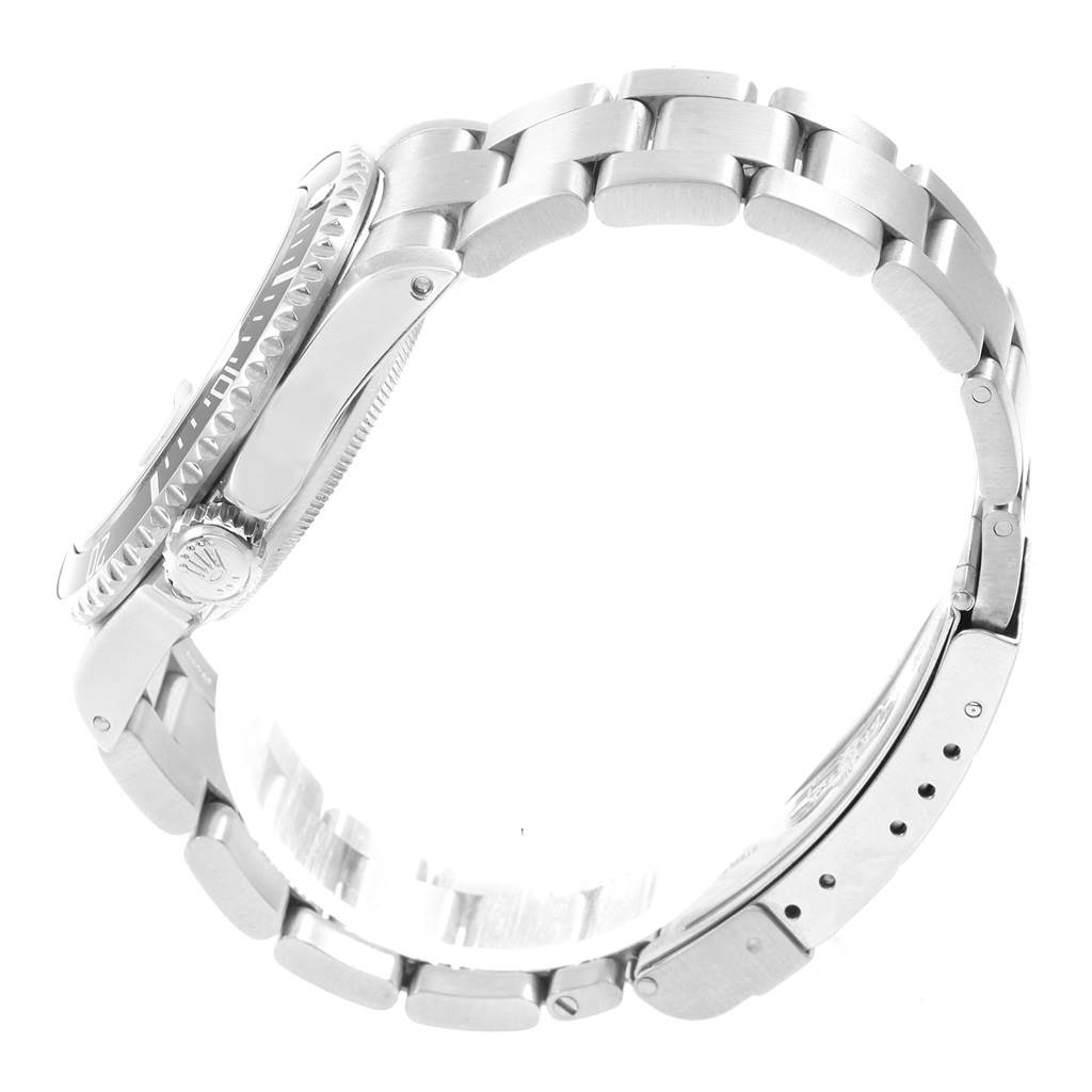 The image shows a side view of a Rolex Submariner 16610 Men
s Stainless Steel Black Dial 16610 Men
s Stainless Steel Black Dial watch, highlighting its case, bezel, crown, and bracelet.