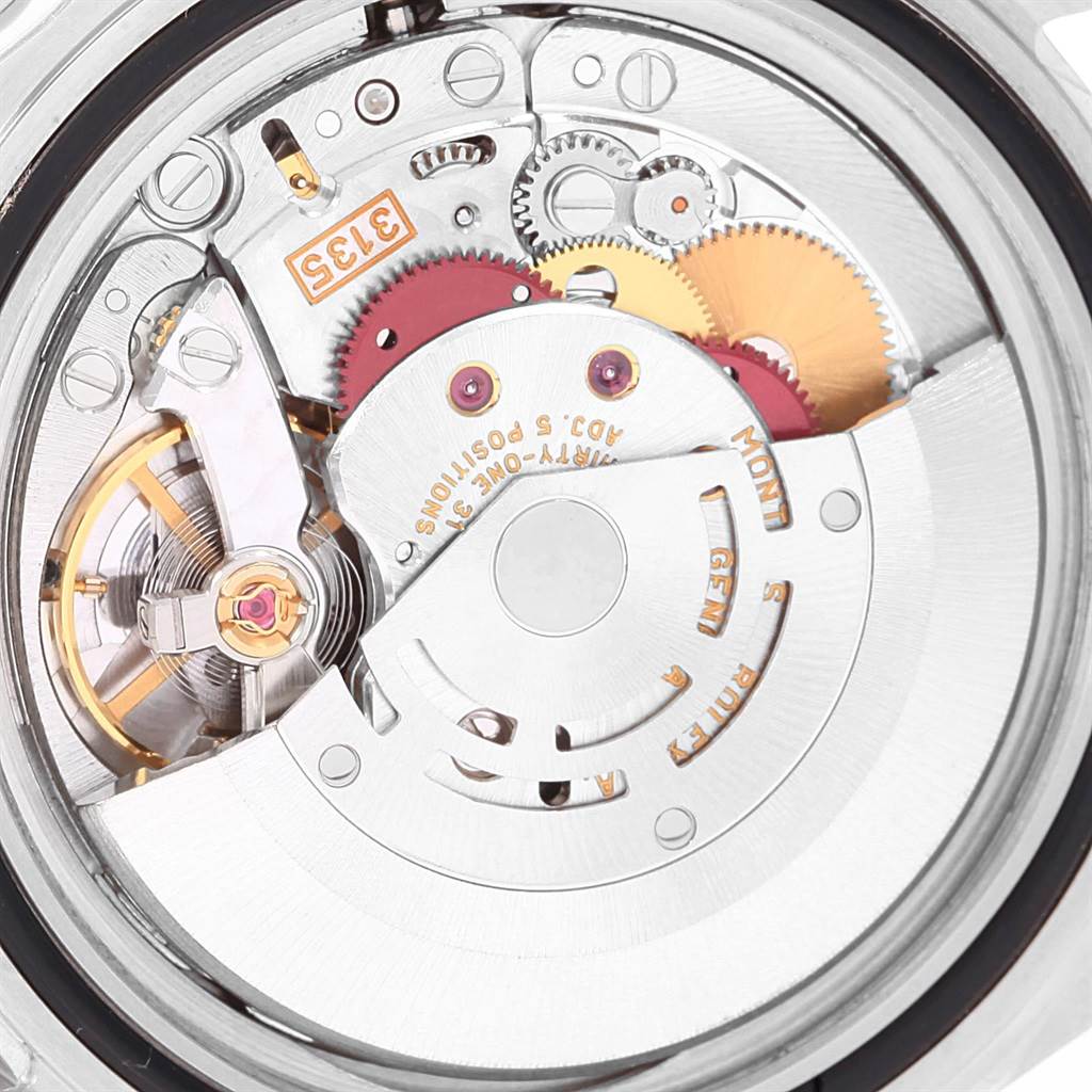 This image shows the movement mechanism of a Rolex Submariner 16610 Men
s Stainless Steel Black Dial 16610 Men
s Stainless Steel Black Dial watch from a close-up, rear angle.