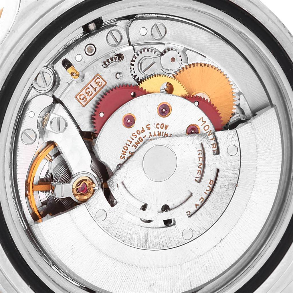 This image shows an inside view of the Rolex Submariner 16613 Men's Steel and Gold (two tone) Blue Dial 16613 Men's Steel and Gold (two tone) Blue Dial's movement and gears.
