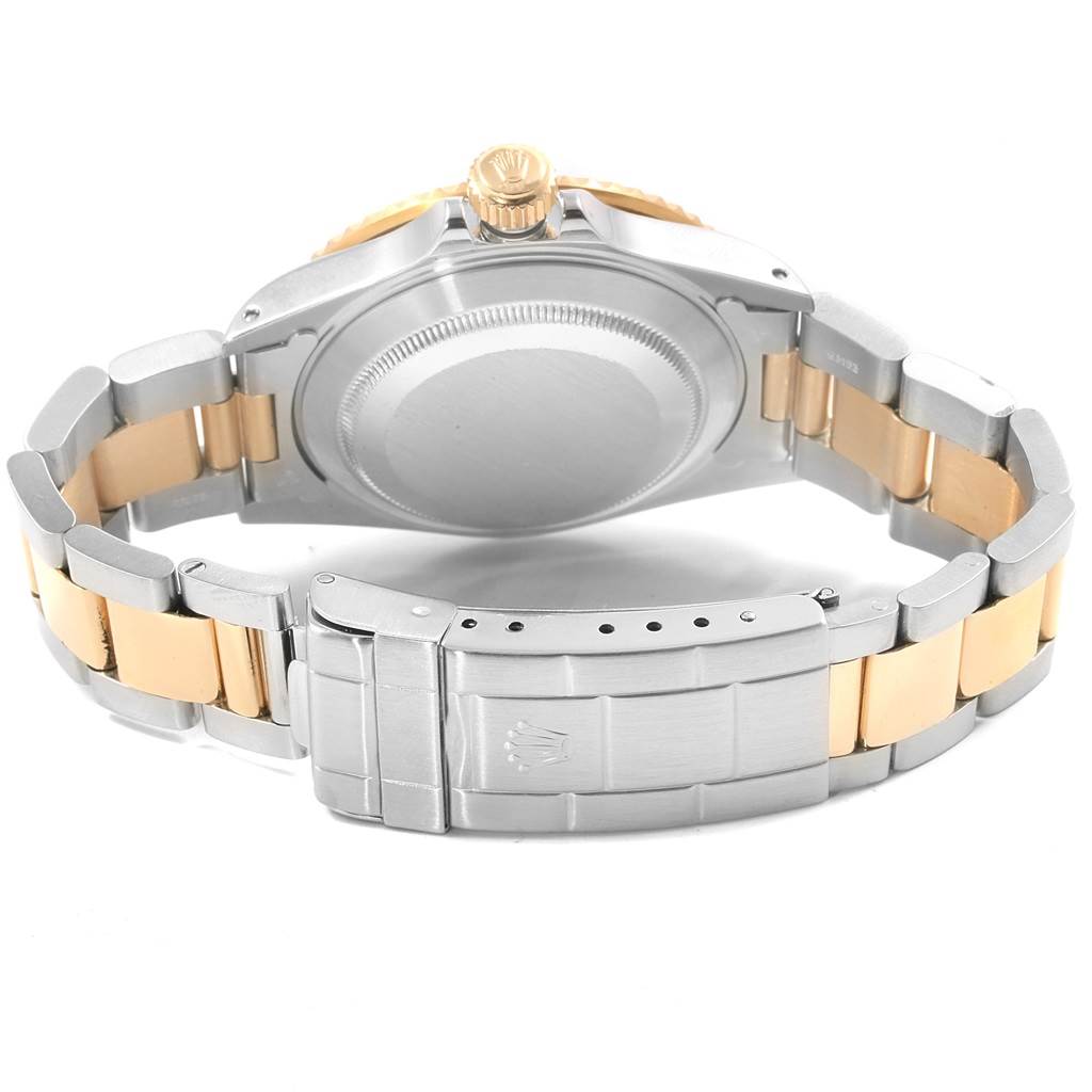 This image shows the back case, crown, and bracelet of a Rolex Submariner 16613 Men's Steel and Gold (two tone) Blue Dial 16613 Men's Steel and Gold (two tone) Blue Dial watch.