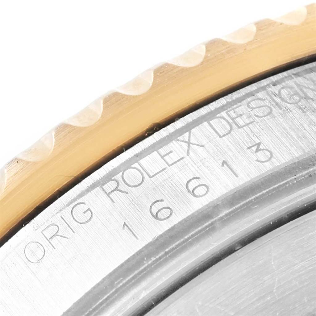 This image shows a close-up of the bezel and case-back, engraved with the Rolex Submariner 16613 Men's Steel and Gold (two tone) Blue Dial 16613 Men's Steel and Gold (two tone) Blue Dial model details.