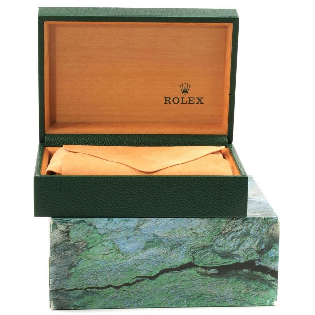 This image shows an open Rolex Submariner 16613 Men's Steel and Gold (two tone) Blue Dial 16613 Men's Steel and Gold (two tone) Blue Dial watch box, revealing the inside lining and outer packaging.