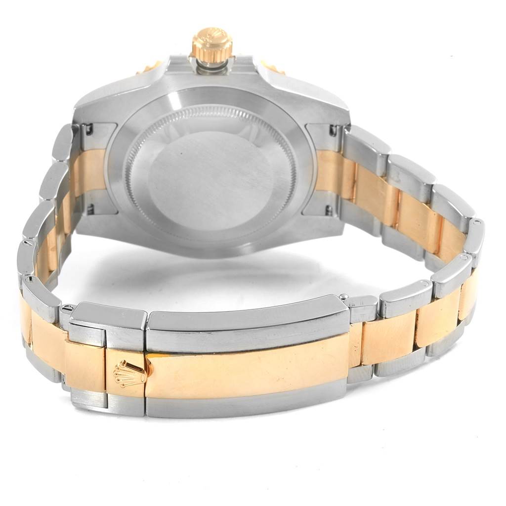 The image shows the back view of a Rolex Submariner 116613 Men's Steel and Gold (two tone) Black Dial 116613 Men's Steel and Gold (two tone) Black Dial watch, highlighting the case back, bracelet, and clasp.