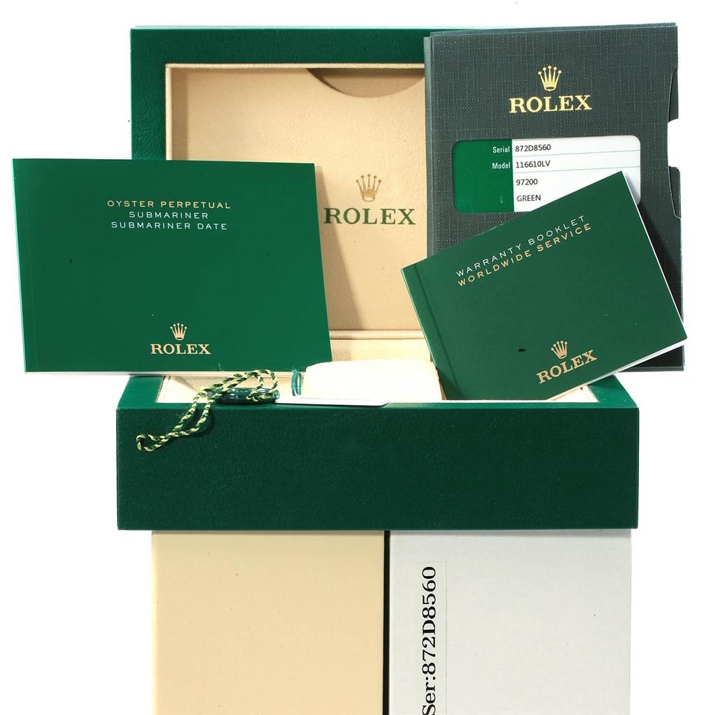The image shows a Rolex Submariner 16610LV Men's Stainless Steel Green Dial 16610LV Men's Stainless Steel Green Dial watch box, warranty booklets, serial card, and a hang tag, viewed from above.