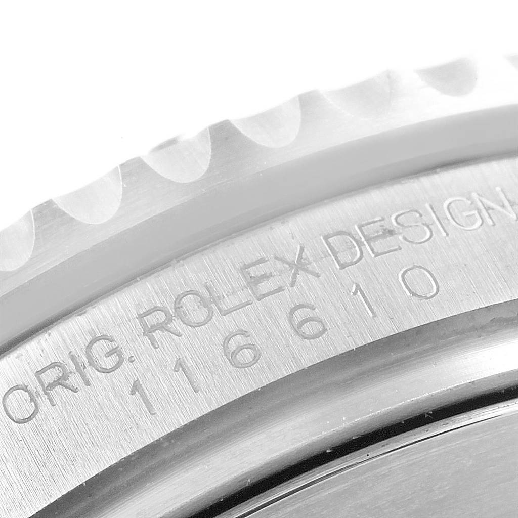 This close-up photo shows a partial view of the engraved bezel and side of the Rolex Submariner 16610LV Men's Stainless Steel Green Dial 16610LV Men's Stainless Steel Green Dial watch case.
