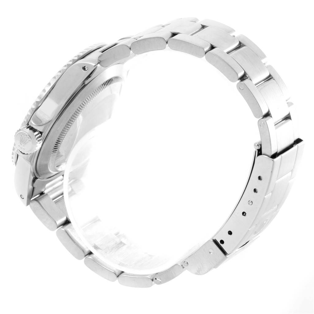 The image shows a side view of a Rolex Submariner 14060 Men
s Stainless Steel Black Dial 14060 Men
s Stainless Steel Black Dial watch, focusing on the bracelet and crown.