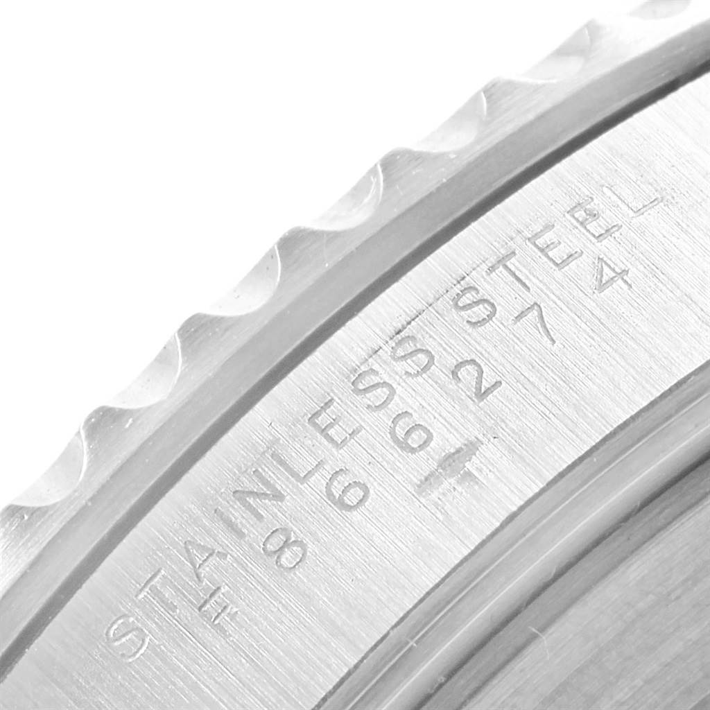 The image showcases a close-up of the engraved stainless steel bezel edge of a Rolex Submariner 14060 Men
s Stainless Steel Black Dial 14060 Men
s Stainless Steel Black Dial watch.