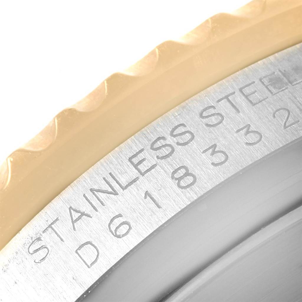This image shows a close-up of the engraved stainless steel back of a Rolex Submariner 16613 Men's Steel and Gold (two tone) Black Dial 16613 Men's Steel and Gold (two tone) Black Dial watch.