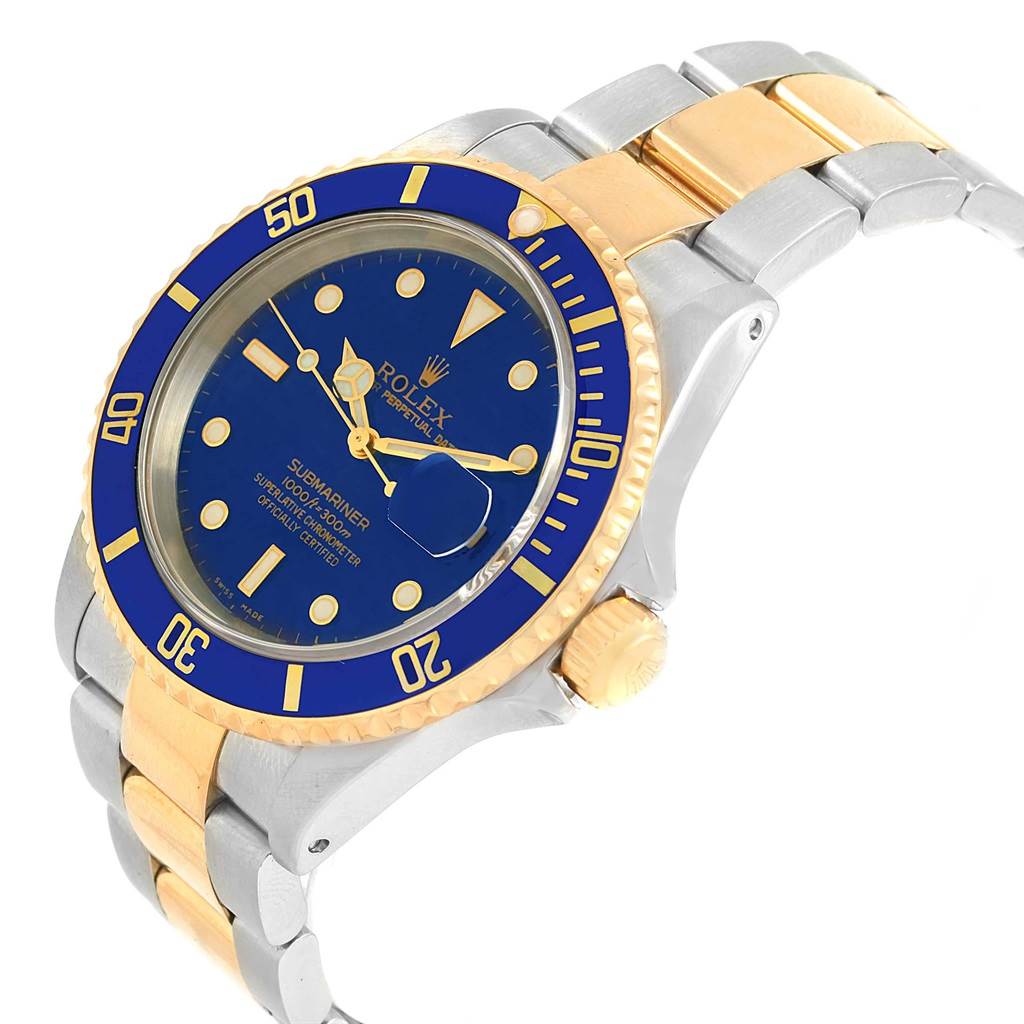 This image shows a tilted angle of a Rolex Submariner 16613 Men
s Steel and Gold (two tone) Blue Dial 16613 Men
s Steel and Gold (two tone) Blue Dial watch highlighting its blue dial, gold bezel, and two-tone bracelet.