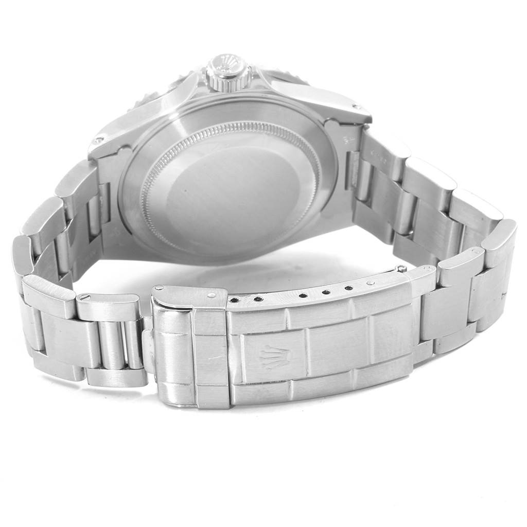 The image shows the backside and clasp of a Rolex Submariner 16610 Men
s Stainless Steel Black Dial 16610 Men
s Stainless Steel Black Dial watch, highlighting the case back and bracelet.