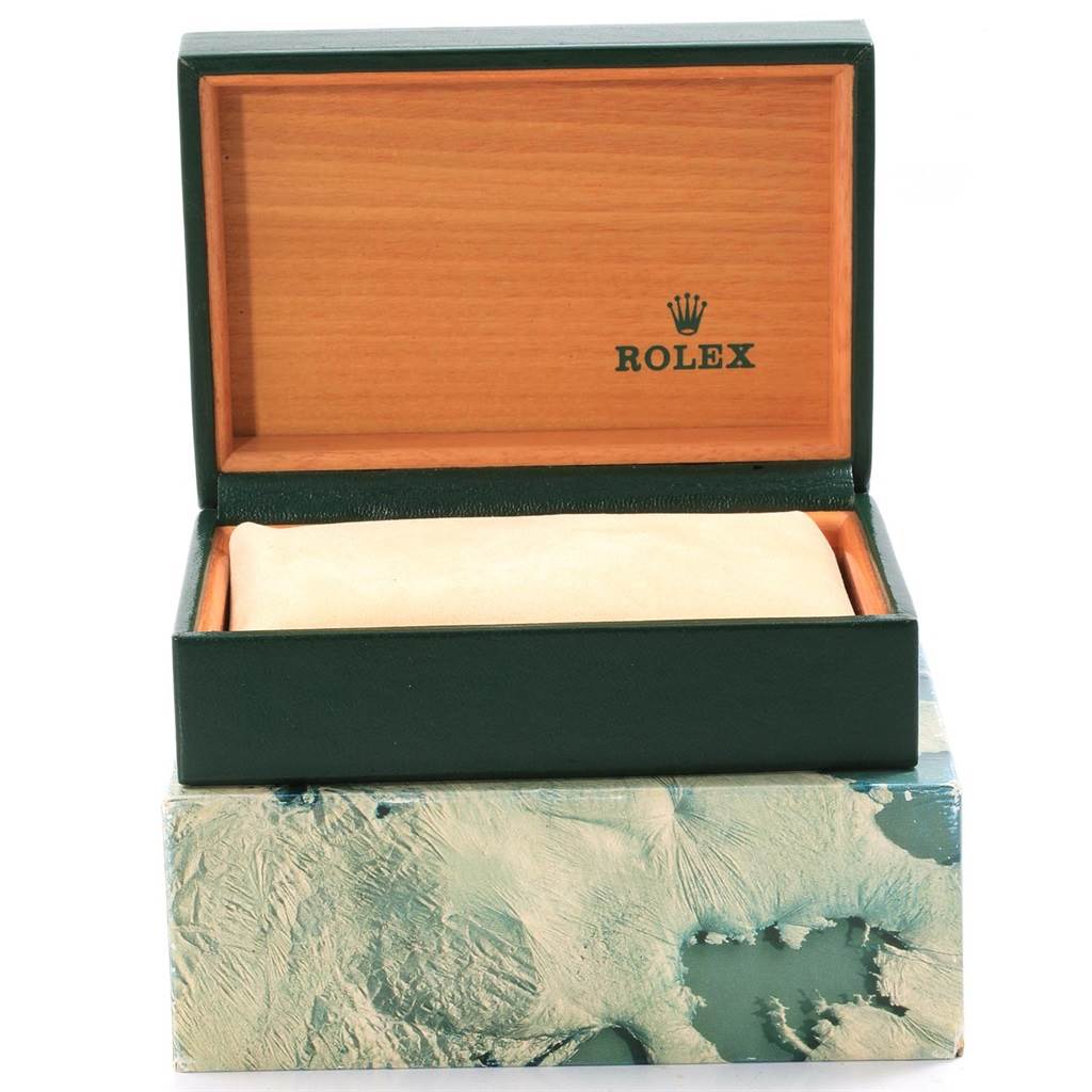 The image shows a Rolex Submariner 16610 Men
s Stainless Steel Black Dial 16610 Men
s Stainless Steel Black Dial watch box with the lid open, revealing the logo inside and a soft cushion inside the box.