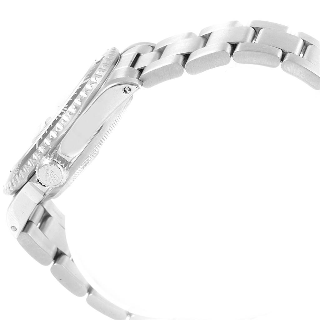 This image shows the Rolex Submariner 16610 Men
s Stainless Steel Black Dial 16610 Men
s Stainless Steel Black Dial watch from a side angle, highlighting the case and a portion of the metal bracelet.