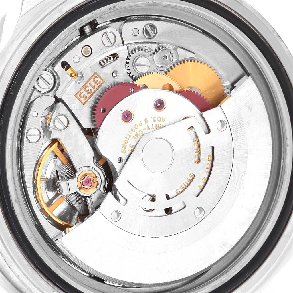 The image shows a close-up view of the internal movement mechanism of a Rolex Submariner 16610 Men
s Stainless Steel Black Dial 16610 Men
s Stainless Steel Black Dial watch.