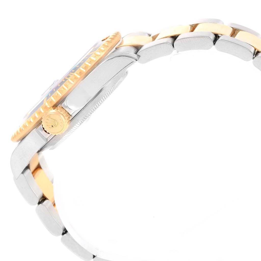 The image shows a side view of the Rolex Submariner 16613 Men's Steel and Gold (two tone) Black Dial 16613 Men's Steel and Gold (two tone) Black Dial watch, highlighting the crown, case, bezel, and part of the bracelet.