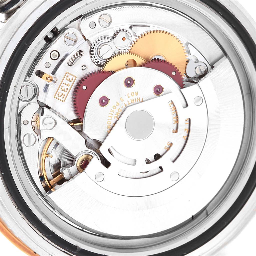 This image shows the internal mechanism of a Rolex Submariner 16613 Men's Steel and Gold (two tone) Black Dial 16613 Men's Steel and Gold (two tone) Black Dial watch from a back view, highlighting gears and components.
