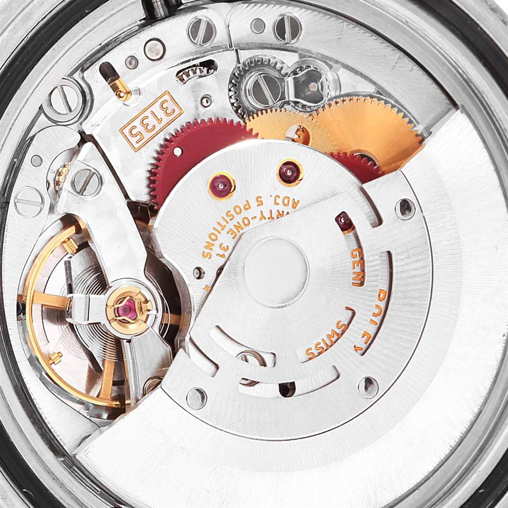 This is a close-up of the internal mechanism of a Rolex Submariner 16610 Men
s Stainless Steel Black Dial 16610 Men
s Stainless Steel Black Dial watch, showing gears and the rotor.