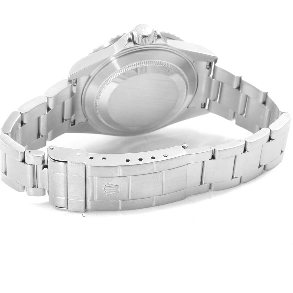 The image shows the back view of a Rolex Submariner 16610 Men
s Stainless Steel Black Dial 16610 Men
s Stainless Steel Black Dial watch, highlighting the case back and bracelet clasp.