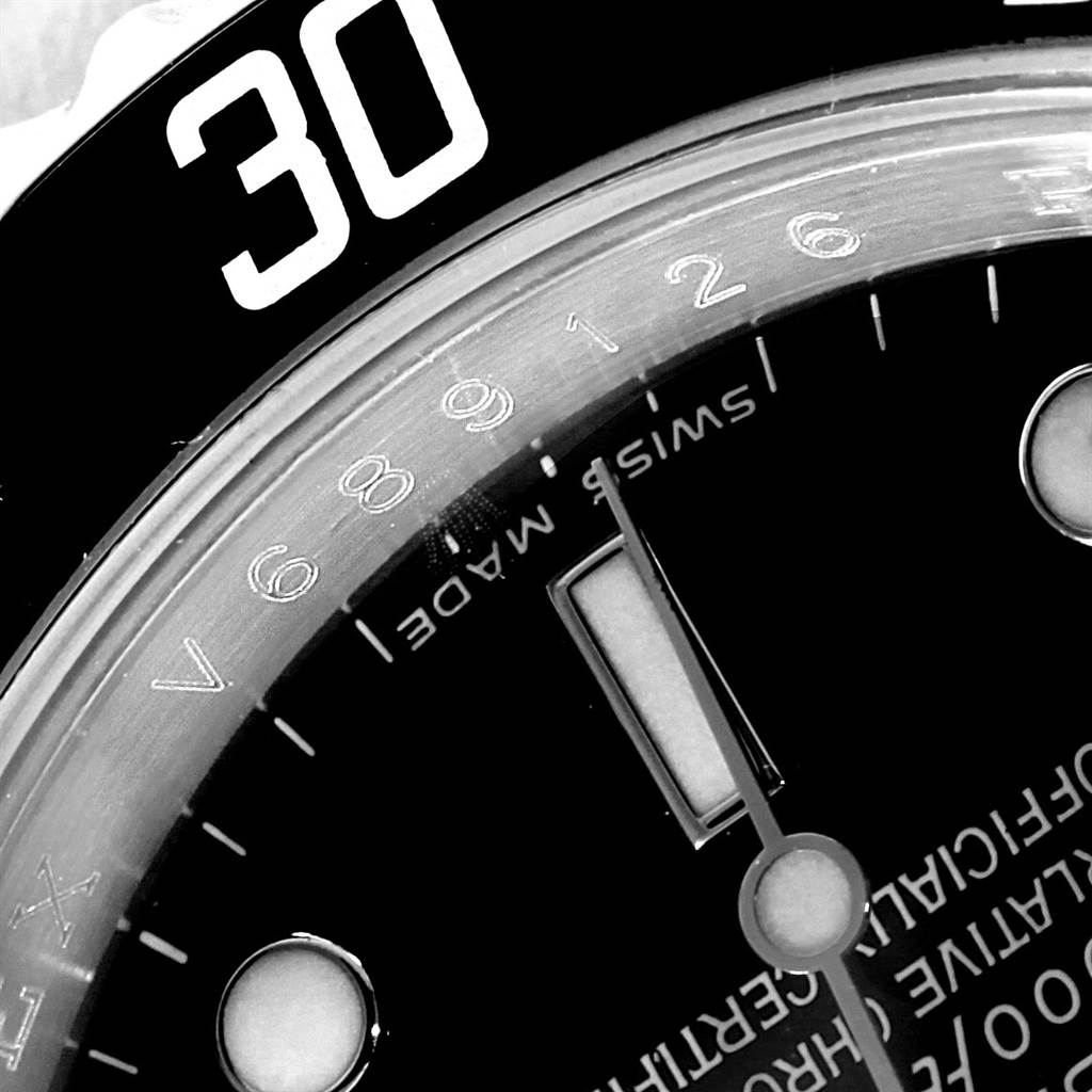 The image shows a close-up view of the Rolex Submariner 16610 Men
s Stainless Steel Black Dial 16610 Men
s Stainless Steel Black Dial watch face, focusing on the bezel, part of the dial, and hour markers.