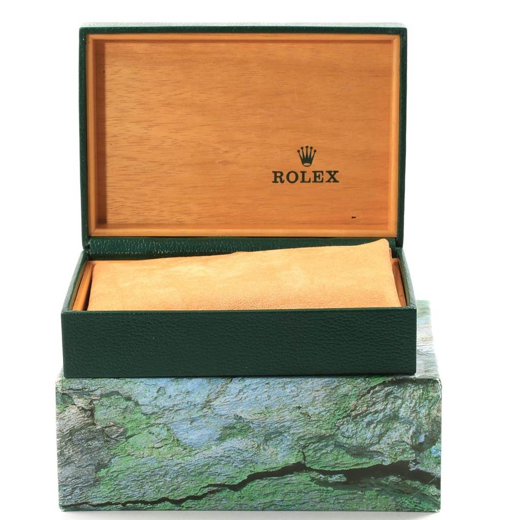 The image shows an open Rolex box for a Submariner model, displaying the interior and exterior packaging.