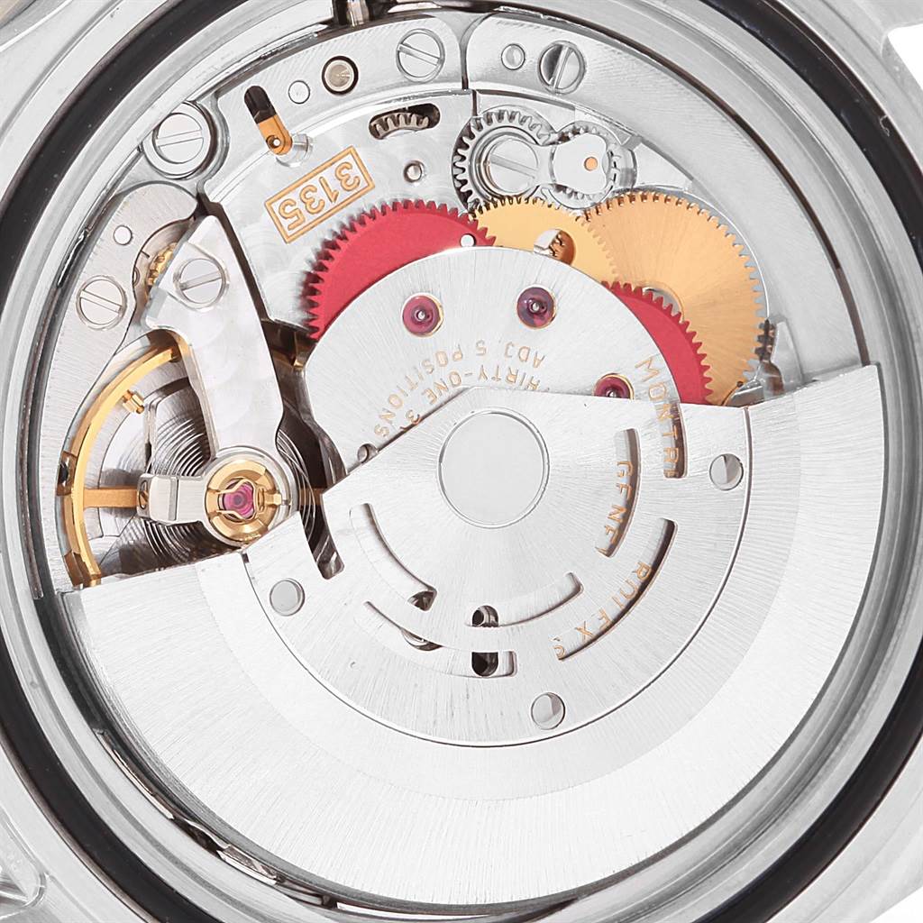The image shows an internal view of the Rolex Submariner 16610 Men
s Stainless Steel Black Dial 16610 Men
s Stainless Steel Black Dial model
s watch movement, highlighting gears and mechanical components.