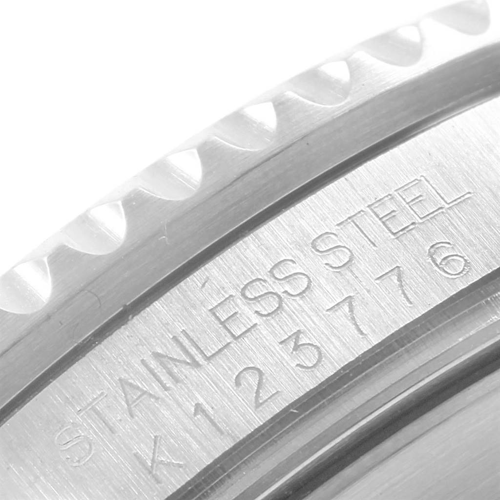 This is a close-up angle of the stainless steel bezel and part of the caseback inscription on a Rolex Submariner 16610 Men
s Stainless Steel Black Dial 16610 Men
s Stainless Steel Black Dial watch.