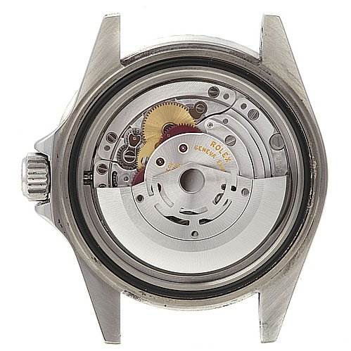 This image shows the interior, specifically the movement mechanism, of a Rolex Submariner 16610 Men's Stainless Steel Black Dial 16610 Men's Stainless Steel Black Dial watch from a back view with the case removed.