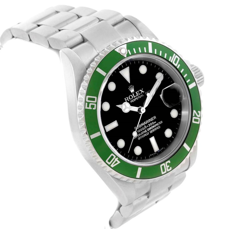 The image shows a Rolex Submariner watch at an angled side view, displaying its green bezel, black dial, and metal bracelet.