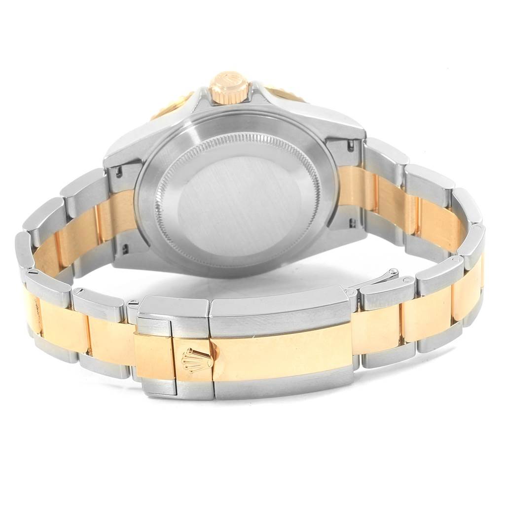 The image shows the back and bracelet of a Rolex Submariner 16613 Men
s Steel and Gold (two tone) Champagne Dial 16613 Men
s Steel and Gold (two tone) Champagne Dial watch, highlighting the two-tone metal design.