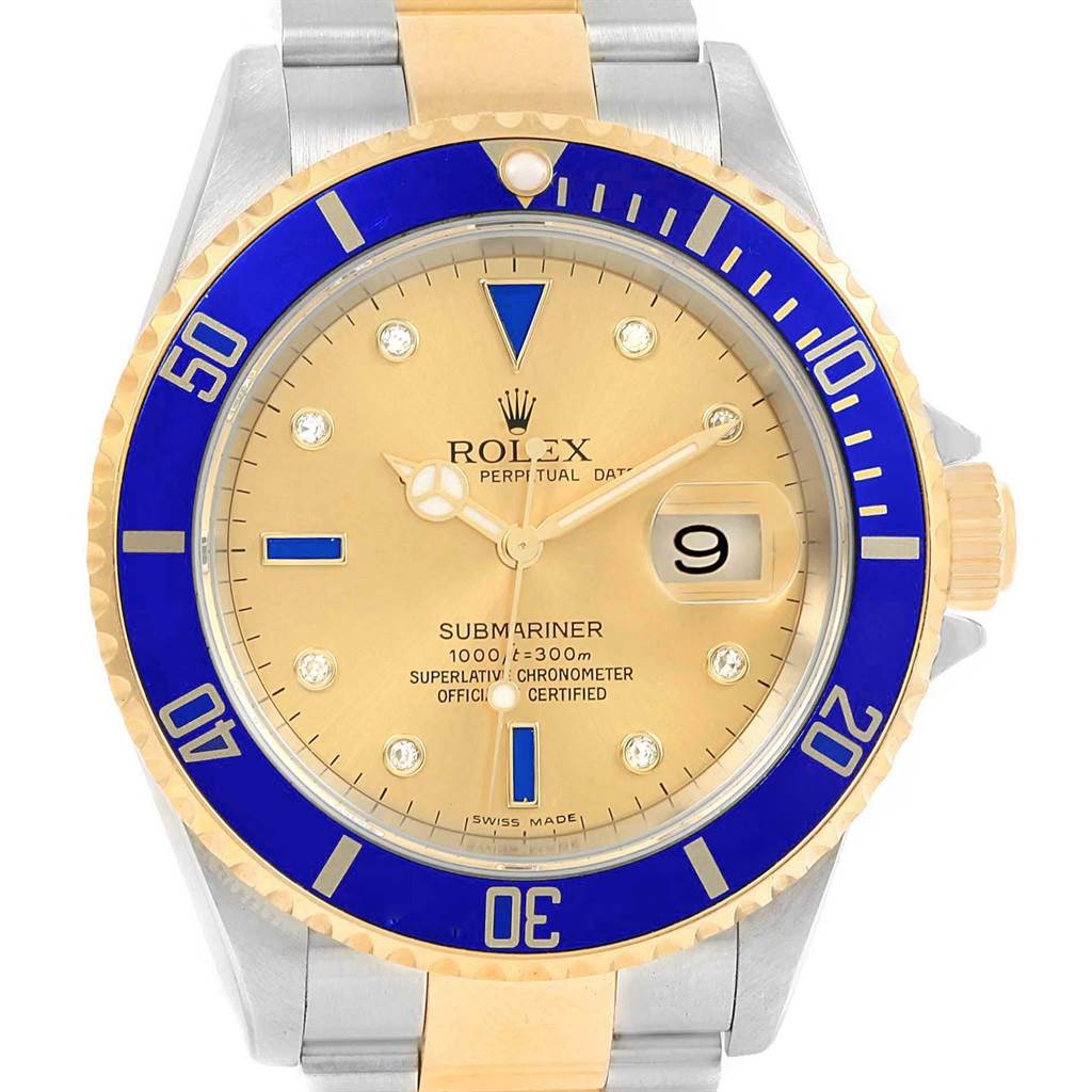 The image shows the front view of a Rolex Submariner 16613 Men
s Steel and Gold (two tone) Champagne Dial 16613 Men
s Steel and Gold (two tone) Champagne Dial watch, highlighting its bezel, dial, hands, and date window.