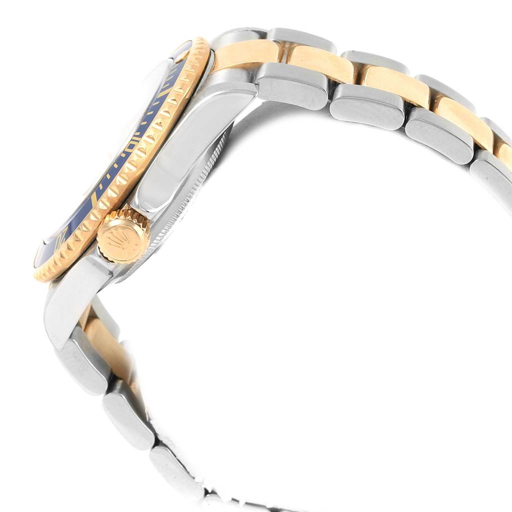 This image shows a side view of the Rolex Submariner 16613 Men
s Steel and Gold (two tone) Champagne Dial 16613 Men
s Steel and Gold (two tone) Champagne Dial watch, highlighting its bezel, crown, and two-tone bracelet.