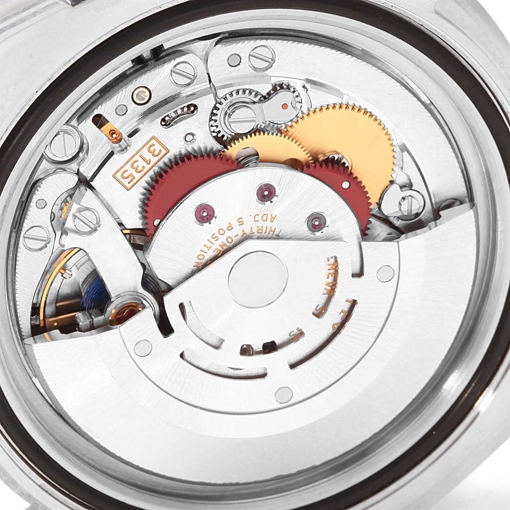This image shows the internal mechanism, specifically the movement, of the Rolex Submariner 116610LV Men
s Stainless Steel Green Dial 116610LV Men
s Stainless Steel Green Dial watch from a close-up angle.